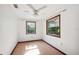 Well-lit bedroom with laminate floors, ceiling fan and outdoor views from the windows at 1836 Cr 609B, Bushnell, FL 33513