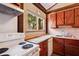 Cozy kitchen with vintage appliances, ample counter space, and plenty of natural light at 1836 Cr 609B, Bushnell, FL 33513