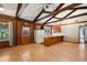 Spacious living room with wood floors, exposed beams, kitchen area, and natural light at 1836 Cr 609B, Bushnell, FL 33513