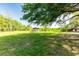 Expansive yard with mature trees, storage shed and covered structure for vehicles or equipment at 1836 Cr 609B, Bushnell, FL 33513