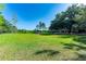 Expansive yard with mature trees, storage shed and covered structure for vehicles or equipment at 1836 Cr 609B, Bushnell, FL 33513