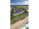 Aerial view of beach community with townhomes in a coastal Florida setting, including a beach and ocean at 23 Marden Dr # 51, Ormond Beach, FL 32176