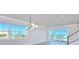 Bright living room with large windows offering beautiful views of the ocean and nearby beach at 23 Marden Dr # 51, Ormond Beach, FL 32176