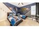 This bedroom features unique Star Wars-themed decor, two beds, and a fun, imaginative design at 7682 Fairfax Dr, Kissimmee, FL 34747