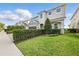 Attractive two-story home with a well-manicured lawn and neatly trimmed hedges at 7682 Fairfax Dr, Kissimmee, FL 34747