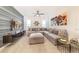 Relaxing living room with a large sectional sofa, modern decor, and a flat-screen TV at 7682 Fairfax Dr, Kissimmee, FL 34747