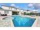 Inviting backyard with a private pool, spa, lounge chairs, and outdoor dining area at 7682 Fairfax Dr, Kissimmee, FL 34747