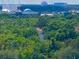 Buildings with domes in the distance are surrounded by lush trees and clear blue skies at 13415 Blue Heron Beach Dr # 1006, Orlando, FL 32821