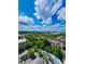 Scenic aerial shot highlighting villas and green landscape under a partly cloudy sky at 13415 Blue Heron Beach Dr # 1006, Orlando, FL 32821