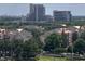 Aerial view of villas and a tall hotel surrounded by lush green trees at 13415 Blue Heron Beach Dr # 1006, Orlando, FL 32821