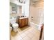 Well-lit bathroom featuring a vanity with storage and a shower-tub combo at 13415 Blue Heron Beach Dr # 1006, Orlando, FL 32821