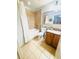 Bathroom featuring a shower-tub combo, neutral tile and wood vanity at 13415 Blue Heron Beach Dr # 1006, Orlando, FL 32821