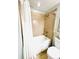 Bathroom with a shower-tub combo and neutral colored tiles at 13415 Blue Heron Beach Dr # 1006, Orlando, FL 32821