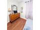 Bedroom featuring a wood dresser and mounted television at 13415 Blue Heron Beach Dr # 1006, Orlando, FL 32821