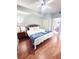 Bright bedroom featuring a ceiling fan and access to an ensuite bathroom at 13415 Blue Heron Beach Dr # 1006, Orlando, FL 32821