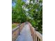 Community boardwalk for enjoying a stroll through lush greenery and nature at 13415 Blue Heron Beach Dr # 1006, Orlando, FL 32821
