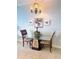 Inviting dining area with glass-top table, tropical-themed décor, and tile flooring at 13415 Blue Heron Beach Dr # 1006, Orlando, FL 32821