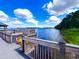 Charming waterfront dock area with seating, perfect for enjoying scenic water views at 13415 Blue Heron Beach Dr # 1006, Orlando, FL 32821
