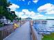 Scenic dock with gazebo offers seating and panoramic waterfront views for relaxation at 13415 Blue Heron Beach Dr # 1006, Orlando, FL 32821