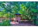 Community gazebo nestled among lush Florida greenery with ample seating and walkways at 13415 Blue Heron Beach Dr # 1006, Orlando, FL 32821