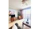 Relaxing living room featuring a balcony and tile flooring at 13415 Blue Heron Beach Dr # 1006, Orlando, FL 32821