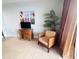 Well-lit living room featuring a balcony and tile flooring at 13415 Blue Heron Beach Dr # 1006, Orlando, FL 32821