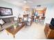 Cozy living room features tile flooring, comfortable seating, and stylish decor at 13415 Blue Heron Beach Dr # 1006, Orlando, FL 32821