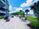 Charming waterfront patio features comfortable seating, lush landscaping, and tranquil views at 13415 Blue Heron Beach Dr # 1006, Orlando, FL 32821
