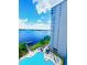 Aerial view of a resort style pool overlooking a lake at 13415 Blue Heron Beach Dr # 1006, Orlando, FL 32821