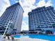Resort pool area with water feature and lounge chairs at 13415 Blue Heron Beach Dr # 1006, Orlando, FL 32821