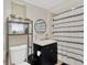 Well-lit bathroom with a decorative mirror, tiled shower and modern vanity at 211 Nw 8Th St, Mulberry, FL 33860