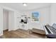 Bright bonus room with modern floors, built-in storage, and natural light from the window at 211 Nw 8Th St, Mulberry, FL 33860