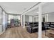 Spacious living room features modern floors, neutral walls, and a comfortable leather sofa set at 211 Nw 8Th St, Mulberry, FL 33860