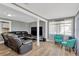 Open-concept living area features modern flooring, comfortable seating, and ample natural light at 211 Nw 8Th St, Mulberry, FL 33860