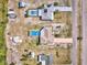 Aerial view of home on a large lot with a pool at 6531 Red Grange Blvd, Indian Lake Estates, FL 33855