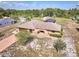 Aerial view of the home and land, showcasing its peaceful and private surroundings at 6531 Red Grange Blvd, Indian Lake Estates, FL 33855