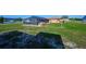Expansive backyard featuring a screened-in pool at 6531 Red Grange Blvd, Indian Lake Estates, FL 33855