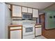 Bright kitchen with stainless steel microwave and range at 6531 Red Grange Blvd, Indian Lake Estates, FL 33855