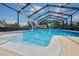 Swimming pool with a spa and screen enclosure, perfect for relaxation and recreation at 6531 Red Grange Blvd, Indian Lake Estates, FL 33855