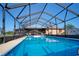 This crystal clear screened-in pool, awaits refreshing swims at 6531 Red Grange Blvd, Indian Lake Estates, FL 33855