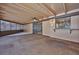 Enclosed porch featuring a ceiling fan and passthrough window at 6531 Red Grange Blvd, Indian Lake Estates, FL 33855