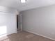 The bedroom has neutral walls, carpet, a flush mount light, and a closet at 6954 Glenbrook Dr, Lakeland, FL 33811