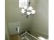 View of the entry foyer with hanging chandelier and staircase at 6954 Glenbrook Dr, Lakeland, FL 33811