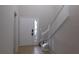 Bright, tiled foyer with a white front door and a staircase at 6954 Glenbrook Dr, Lakeland, FL 33811