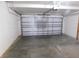 Spacious two-car garage with automatic door offers secure parking and additional storage at 6954 Glenbrook Dr, Lakeland, FL 33811