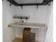 Functional laundry room boasts granite countertop and cabinets for storage and convenience at 6954 Glenbrook Dr, Lakeland, FL 33811