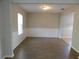 Spacious living room with wood flooring and large window at 6954 Glenbrook Dr, Lakeland, FL 33811
