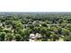 Property featuring a private residence surrounded by lush green trees and landscape at 7165 Cr 655, Bushnell, FL 33513