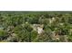 High-angle view of the community homes nestled among green trees and natural surroundings at 7165 Cr 655, Bushnell, FL 33513