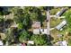 Overhead shot of a home featuring roof, driveway, and surrounding landscape at 7165 Cr 655, Bushnell, FL 33513